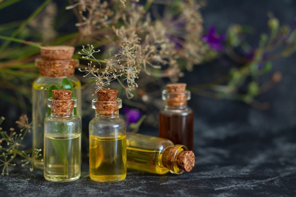 aromatherapy-spa-massage-skin-care-alternative-medicine-concept-herbal-essential-oils-glass-bottles