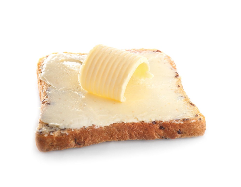 slice-bread-with-butter-white-background