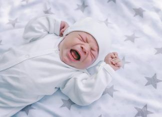 newborn-baby-is-lying-crib-screaming-crying-tired-hungry